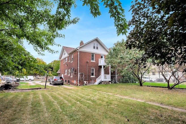 776 Woodmere St, Detroit, MI 48209 - view of side of property featuring a chimney and brick siding