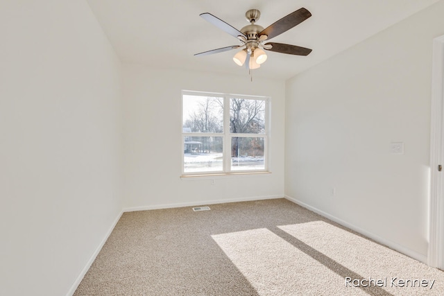 spare room with carpet and ceiling fan