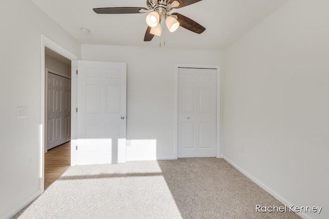 unfurnished bedroom with carpet flooring, ceiling fan, and a closet