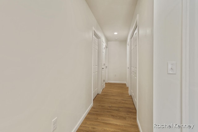 corridor featuring hardwood / wood-style flooring