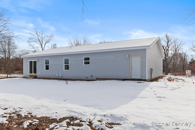 view of snow covered property