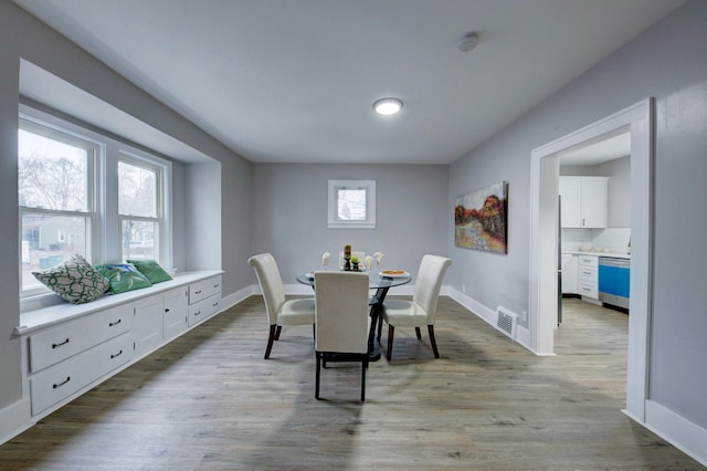 dining area with light hardwood / wood-style flooring