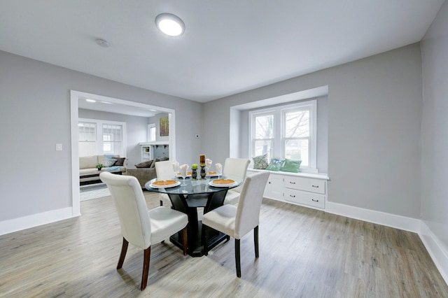 dining space with light wood-type flooring