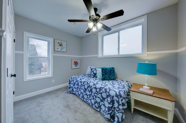 bedroom featuring light carpet and ceiling fan