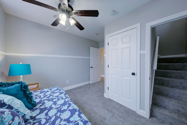 carpeted bedroom featuring ceiling fan