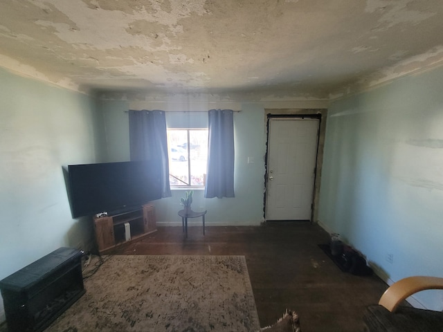 unfurnished living room featuring dark hardwood / wood-style floors