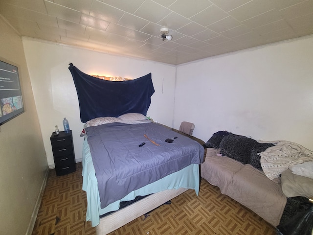 bedroom with parquet flooring