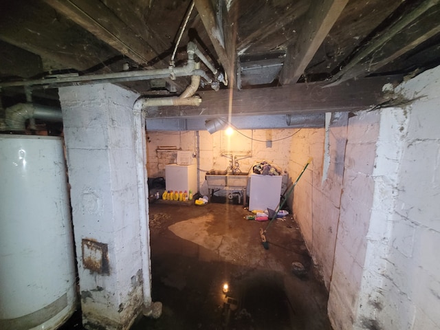 basement featuring washer / dryer and gas water heater