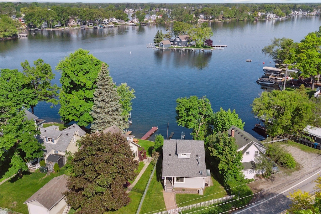 birds eye view of property with a water view