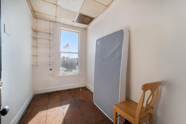 interior space featuring a paneled ceiling