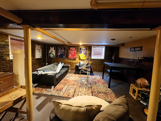 living room featuring brick wall