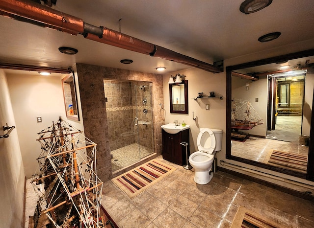 bathroom featuring toilet, vanity, and walk in shower