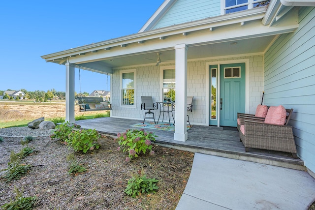 view of exterior entry featuring a porch