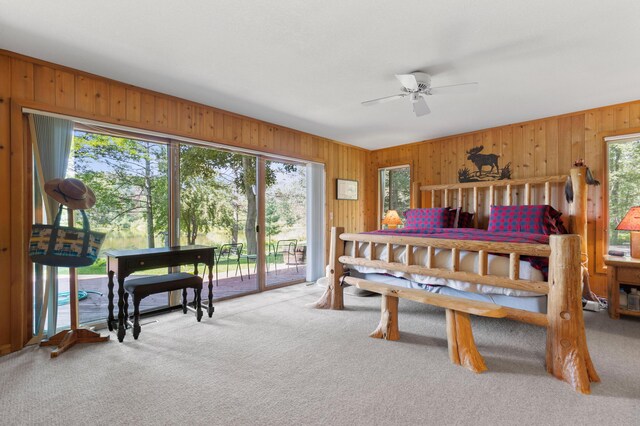 100 W Adams Rd, Farwell, MI 48622 - bedroom with access to outside, multiple windows, wooden walls, and light colored carpet