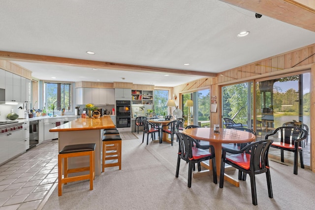 100 W Adams Rd, Farwell, MI 48622 - dining room with recessed lighting, a textured ceiling, and wood walls