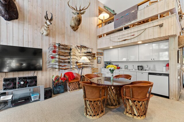 100 W Adams Rd, Farwell, MI 48622 - dining area with wooden walls, light colored carpet, and a towering ceiling
