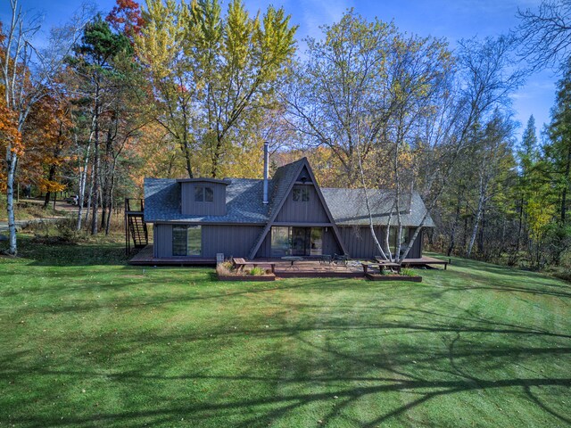 100 W Adams Rd, Farwell, MI 48622 - rear view of house featuring a yard and a wooden deck