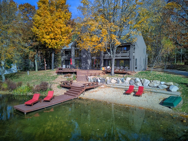 100 W Adams Rd, Farwell, MI 48622 - rear view of house with a deck with water view