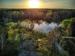 100 W Adams Rd, Farwell, MI 48622 - water view with a heavily wooded area