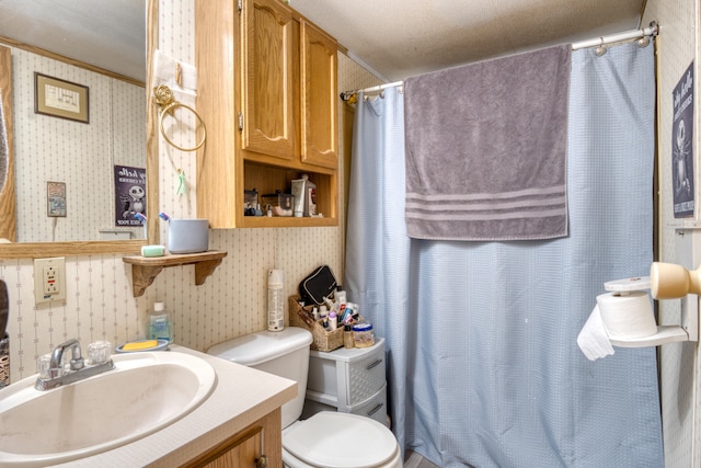 bathroom with ornamental molding, a textured ceiling, toilet, vanity, and a shower with shower curtain