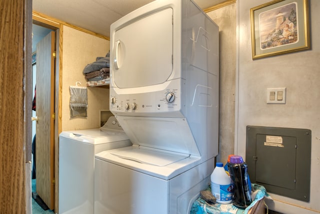 laundry area featuring stacked washer and dryer