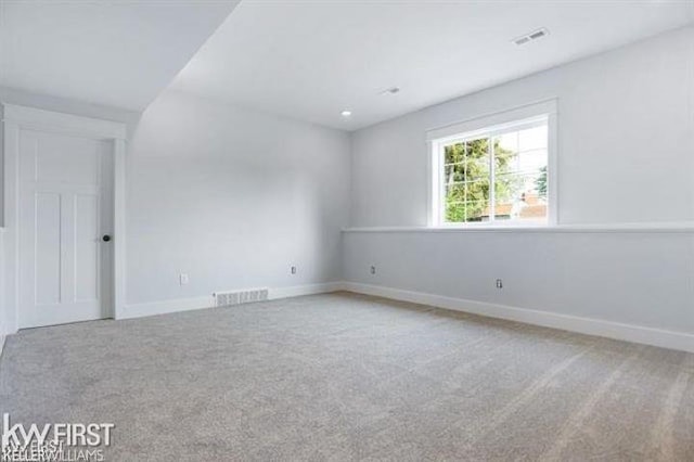 spare room featuring carpet floors