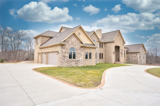 view of front of property featuring a garage and a front yard