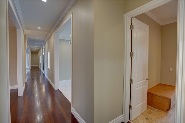 hall with crown molding and hardwood / wood-style flooring