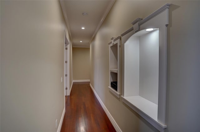 hallway featuring ornamental molding and dark hardwood / wood-style flooring