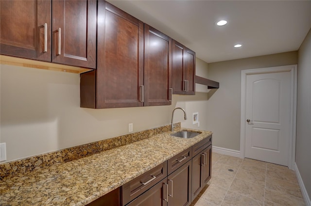 8498 Highgrove Ct, Grand Blanc, MI 48439 - kitchen featuring a sink, recessed lighting, baseboards, light stone countertops, and light tile patterned floors