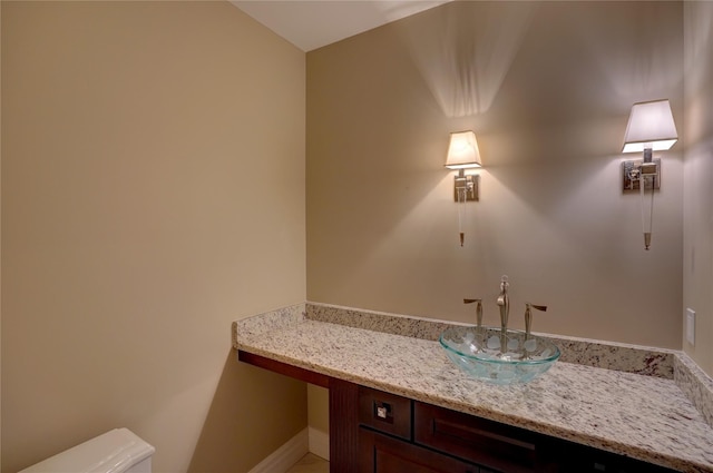 bathroom featuring toilet and sink