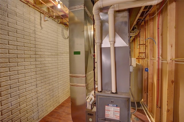 utility room featuring heating unit