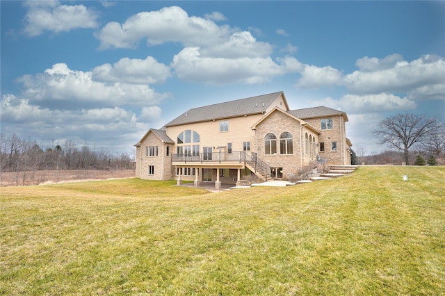 8498 Highgrove Ct, Grand Blanc, MI 48439 - back of house featuring a deck, a yard, stairway, and brick siding