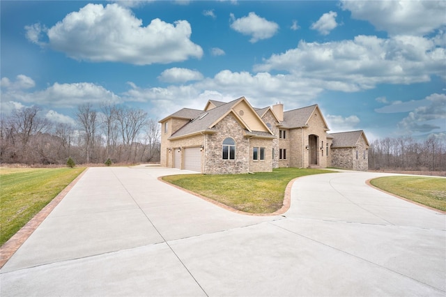 view of front of property with a garage and a front lawn