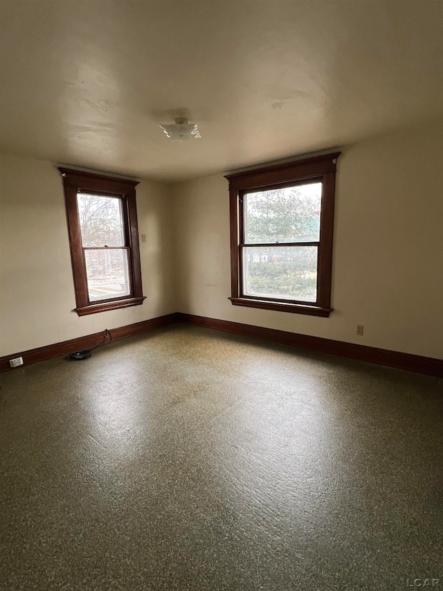 unfurnished room with plenty of natural light