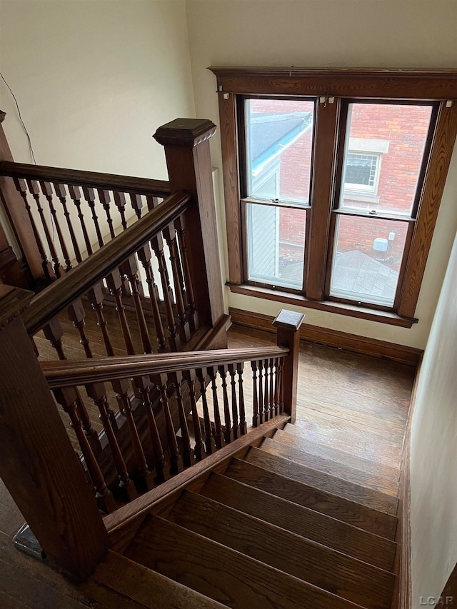 staircase featuring hardwood / wood-style flooring