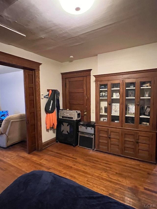 hallway with dark hardwood / wood-style floors