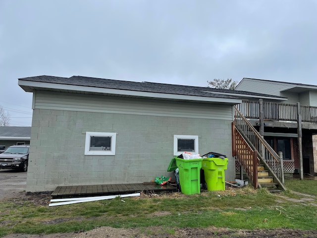 view of side of property with a wooden deck