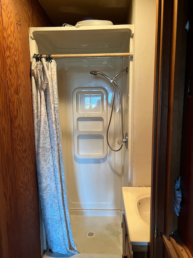 bathroom featuring vanity and walk in shower