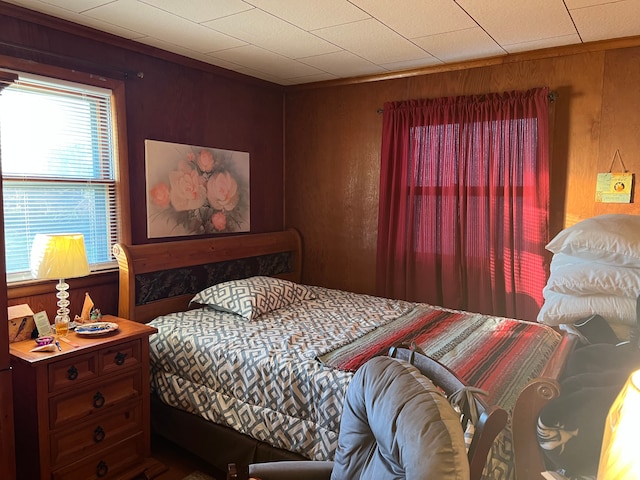 bedroom with wooden walls