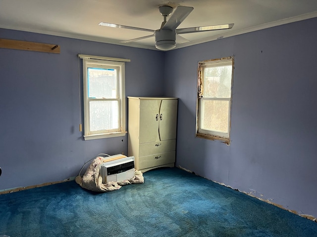 unfurnished bedroom featuring ceiling fan, carpet, and ornamental molding