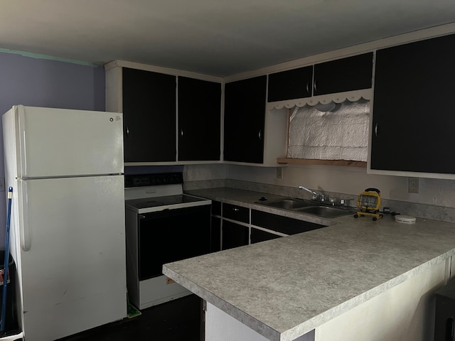 kitchen featuring kitchen peninsula, white appliances, and sink