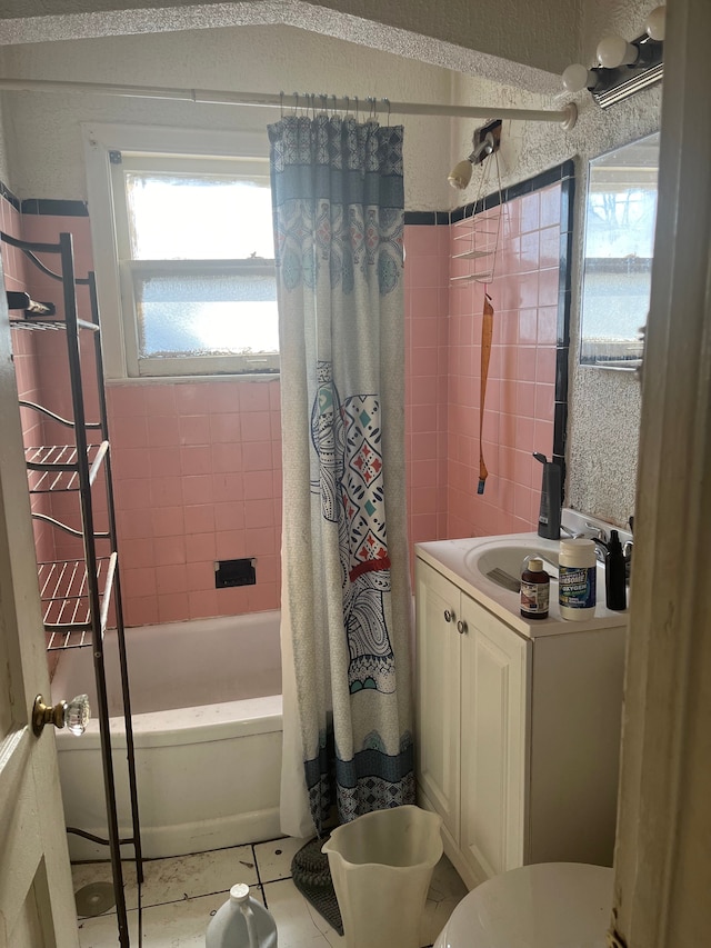 full bathroom featuring tile patterned floors, vanity, toilet, and shower / tub combo with curtain