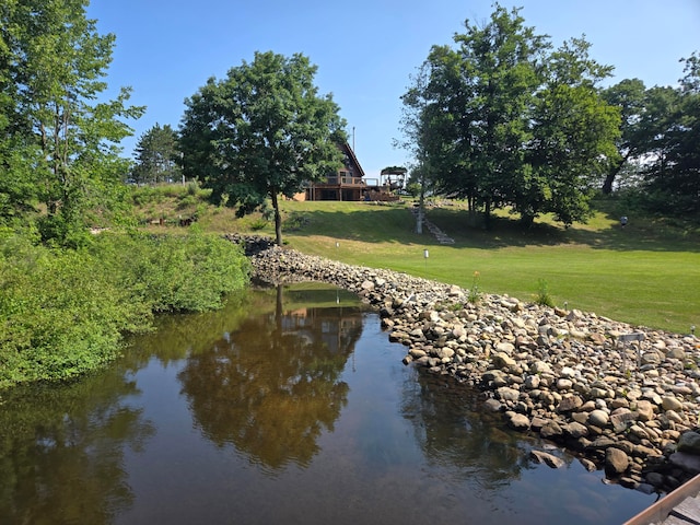 view of home's community featuring a yard