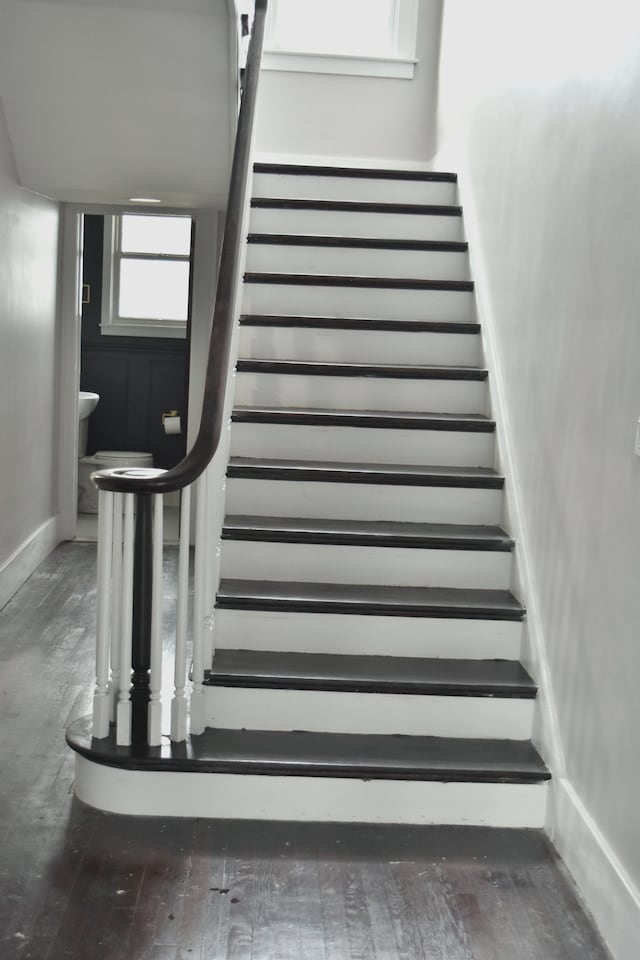 stairs featuring hardwood / wood-style flooring