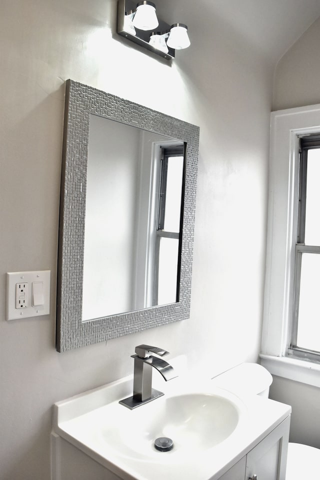 bathroom with vanity and toilet