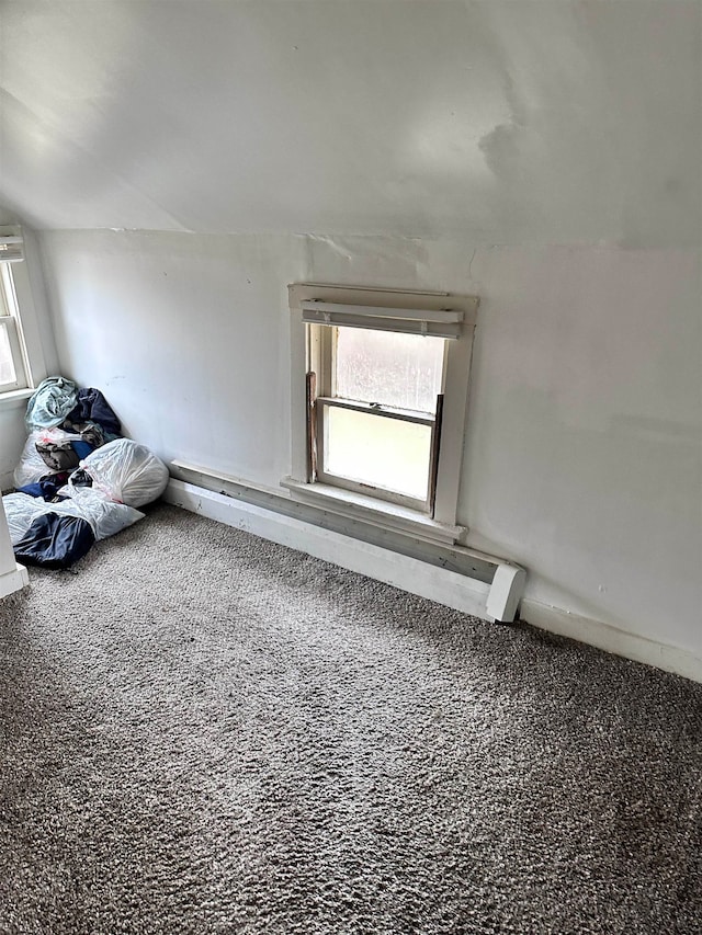 bonus room featuring carpet flooring and lofted ceiling