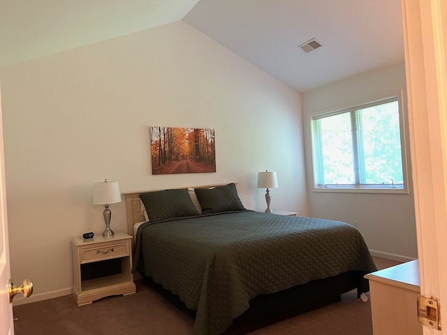 5678 N Crossover Dr Unit 2, Bellaire, MI 49615 - carpeted bedroom with lofted ceiling and baseboards