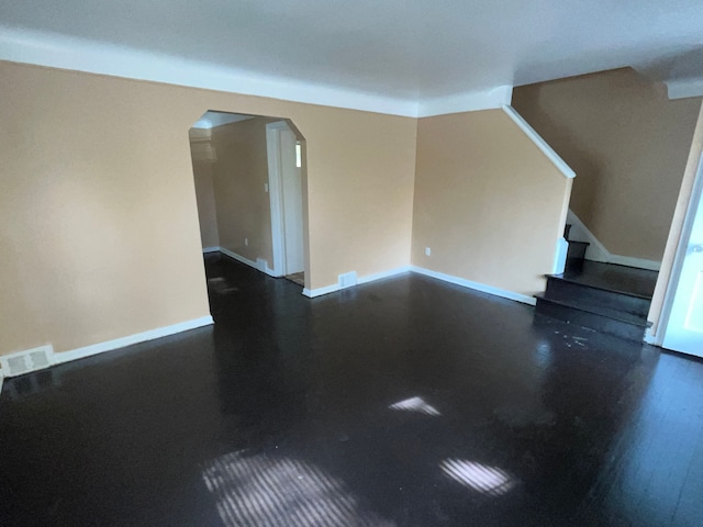 empty room featuring dark hardwood / wood-style floors