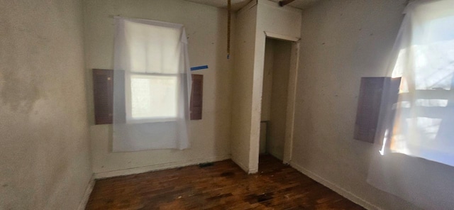 spare room featuring dark hardwood / wood-style flooring